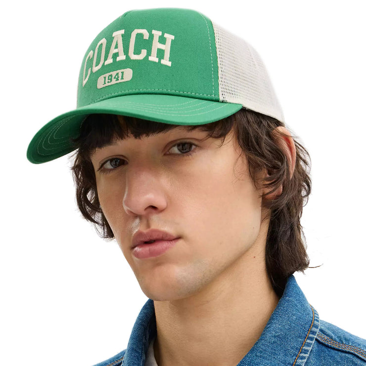 Male Model wearing Coach 1941 Embroidered Trucker Hat Kelly CAA61
