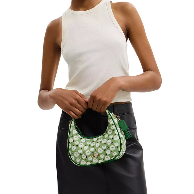 Model Carrying Coach Carmen Mini Crossbody Bag With Floral Print - Kelly Multi CBI58