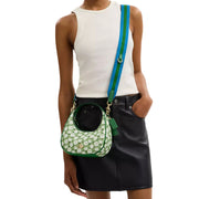 Model Wearing Coach Carmen Mini Crossbody Bag With Floral Print - Kelly Multi CBI58