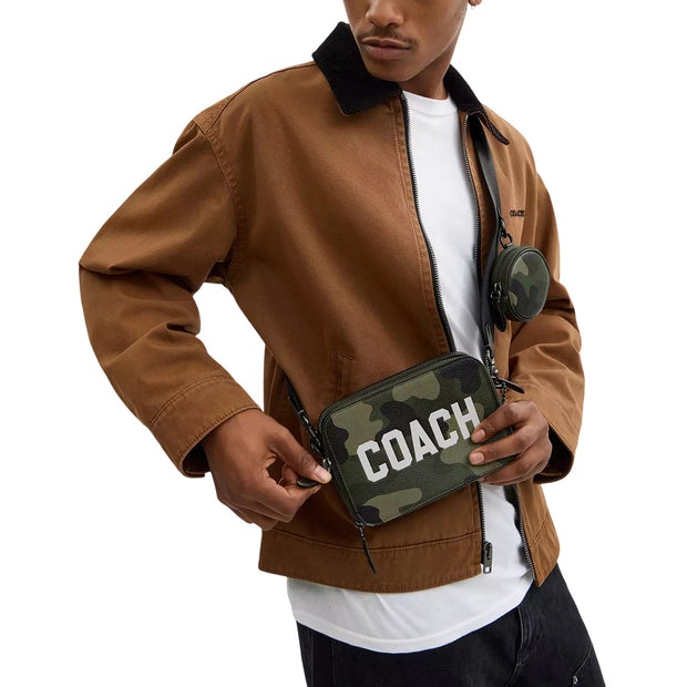 Model Wearing Coach Charter Crossbody Bag 19 With Camo Print And Coach Graphic - Camo CZ007