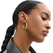 Model Wearing Coach Medium Hoop Earrings - Gold CBW15