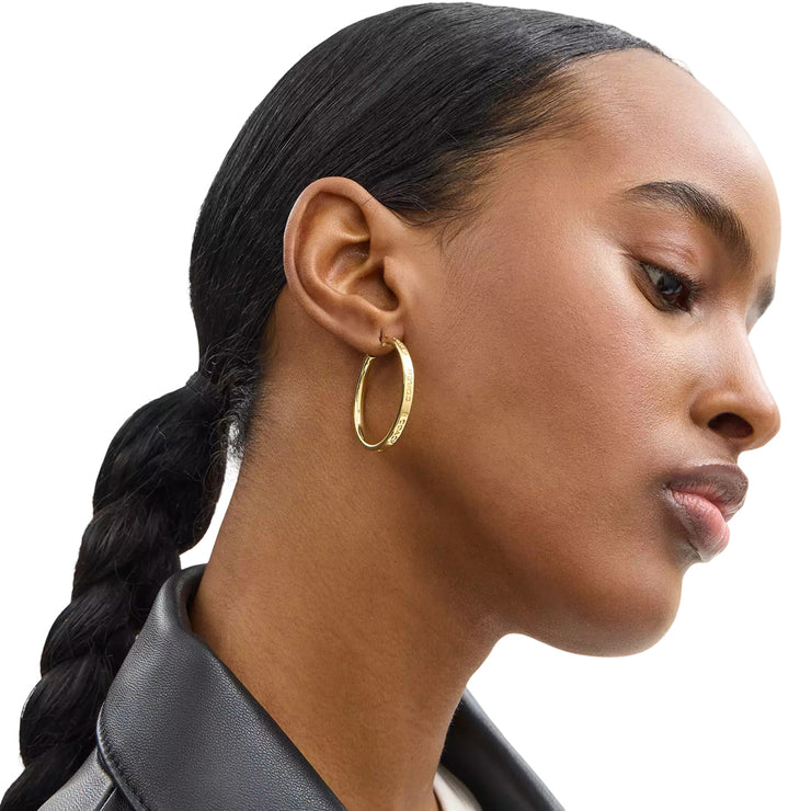 Model Wearing Coach Medium Hoop Earrings - Gold CBW15