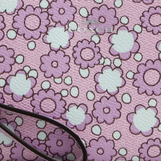 Closeup of Coach Corner Zip Wristlet With Floral Print - Lily Multi CBP28