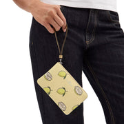Model Holding Coach Corner Zip Wristlet with Lemon Print - Garden Glade Multi CBB80