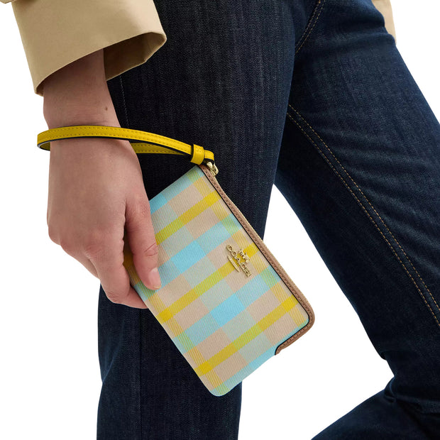 Model Wearing Coach Corner Zip Wristlet With Plaid Print - Bright Maize Multi CBP18