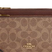 Closeup of Coach Double Zip Wallet In Signature Canvas - Tan/ Brown CX161