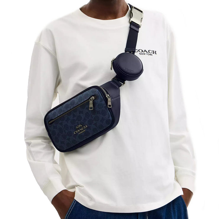 Model Wearing Coach Elias Belt Bag In Signature Canvas - Denim/ Midnight Navy CZ400