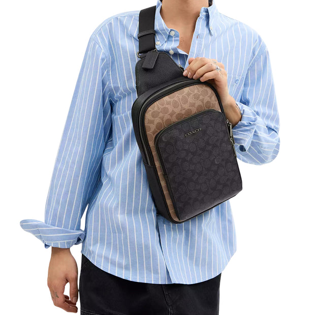 Model Wearing Coach Ethan Pack Bag In Blocked Signature Canvas Bag - Tan/ Charcoal/ Black CZ394
