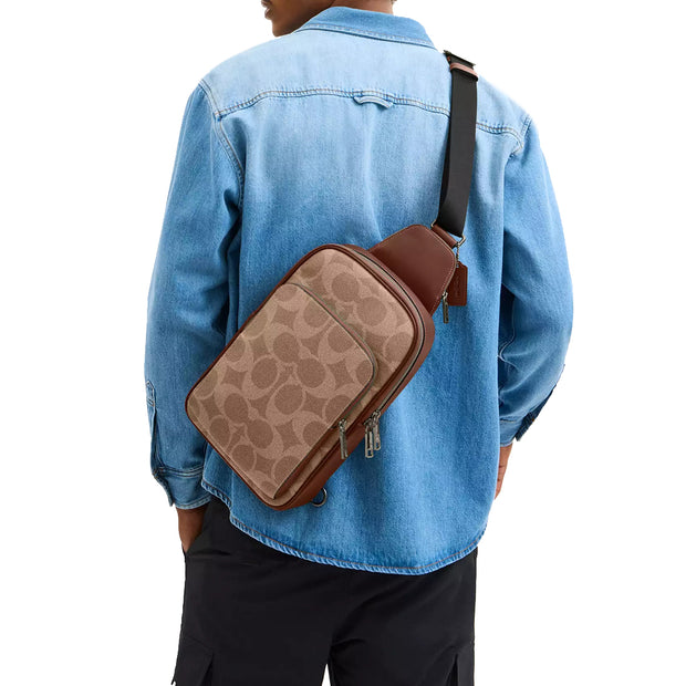 Model Wearing Coach Ethan Pack Bag In Signature Canvas - Tan/ Vintage Brown CBI71