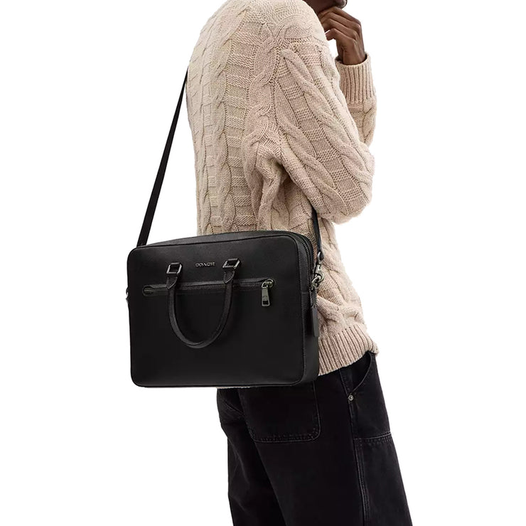 Male model carrying Coach Ethan Slim Brief Bag in Black CR271 on his shoulder