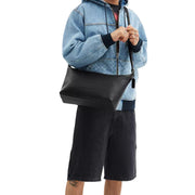 Model Wearing Coach Finn Crossbody Bag - Black CAJ70