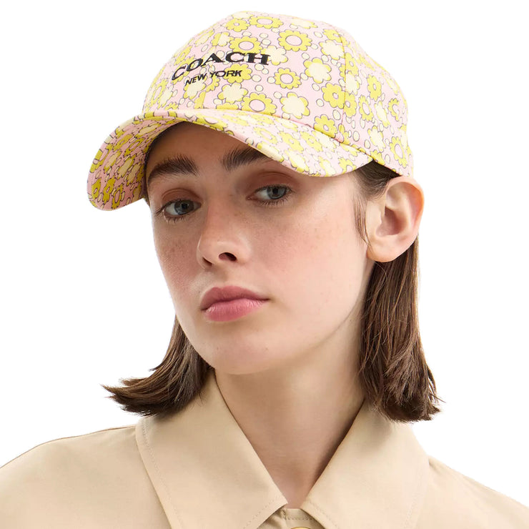 Female model wearing Coach Floral Print Baseball Hat in Lime CBO67