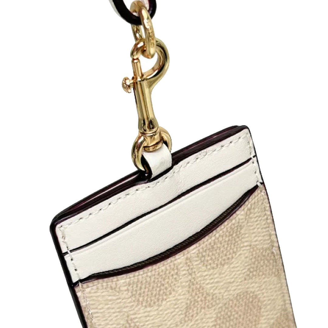 Buy Coach Id Lanyard In Signature Canvas in Sand/ Chalk CZ285