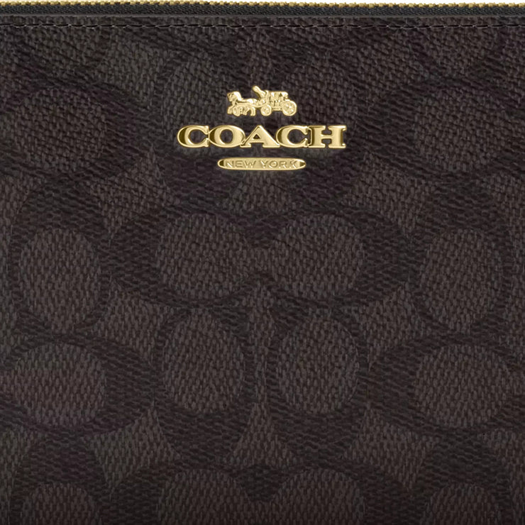 Closeup of Coach Large Corner Zip Wristlet In Signature Canvas - Walnut/ Black CZ277