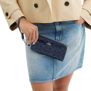 Model View of Coach Long Zip Around Wallet In Signature Canvas - Dark Denim CAO78