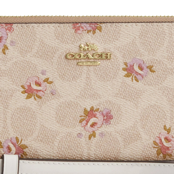 Closeup of Coach Long Zip Around Wallet In Signature Canvas With Floral Print - Sand Multi CAR06