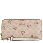 Front View of Coach Long Zip Around Wallet In Signature Canvas With Floral Print - Sand Multi CAR06