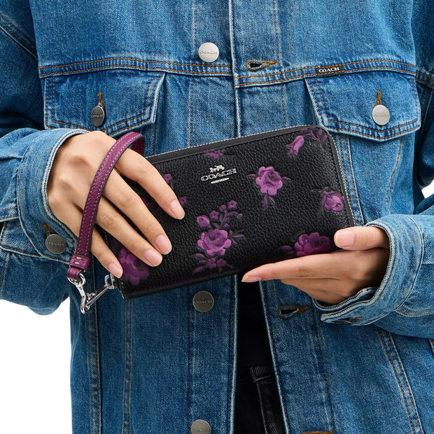 Model Carrying Coach Long Zip Around Wallet With Floral Print - Black/ Purple CCL36