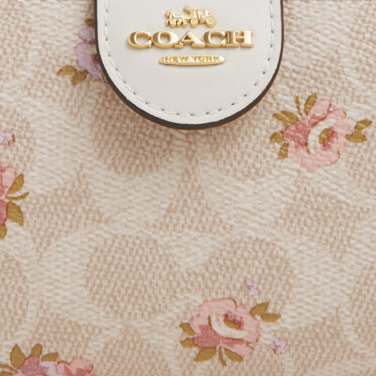 Closeup of Coach Medium Corner Zip Wallet In Signature Canvas With Floral Print - Sand Multi CAR13