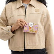 Model View of Coach Medium Corner Zip Wallet In Signature Canvas With Floral Print - Sand Multi CBO30