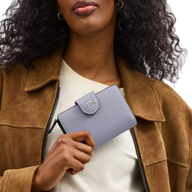 Model Holding Coach Medium Corner Zip Wallet- Mist CBO41