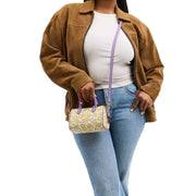 Model Wearing Coach Mini Rowan Crossbody Bag With Floral Print - Lilac Multi CBM69