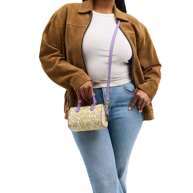 Model Wearing Coach Mini Rowan Crossbody Bag With Floral Print - Lilac Multi CBM69