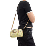 Model Wearing Coach Mini Rowan Crossbody Bag With Lemon Print - Garden Glade Multi CAL19