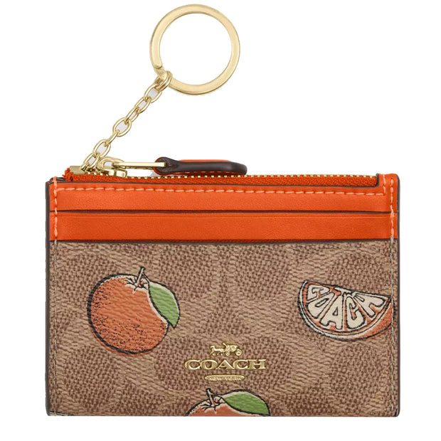 Front View of Coach Mini Skinny Id Case In Signature Canvas With Orange Print - Tan Multi CAR21