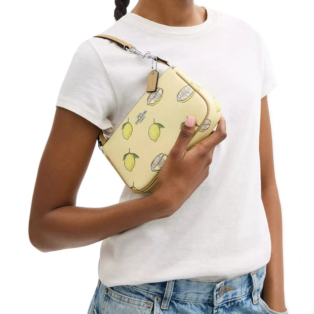 Model Wearing Coach Nolita 19 Wristlet/ Top Handle/ Clutch Bag With Lemon Print - Garden Glade Multi CAL26