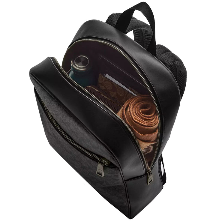 Interior view of Coach Owen Backpack Bag In Signature Canvas - Charcoal/ Black CAJ90, shown with organized contents including tech accessories, documents, water bottle & umbrella