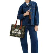 Model Carrying Coach Relay Tote Bag 34 With Camo Print And Coach Graphic - Camo CY811