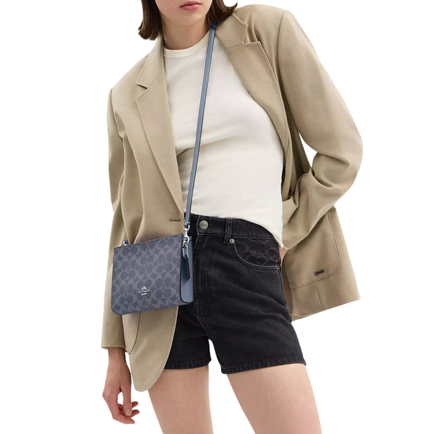 Model Wearing Coach Slim Crossbody Bag In Signature Canvas - Chambray CBM46