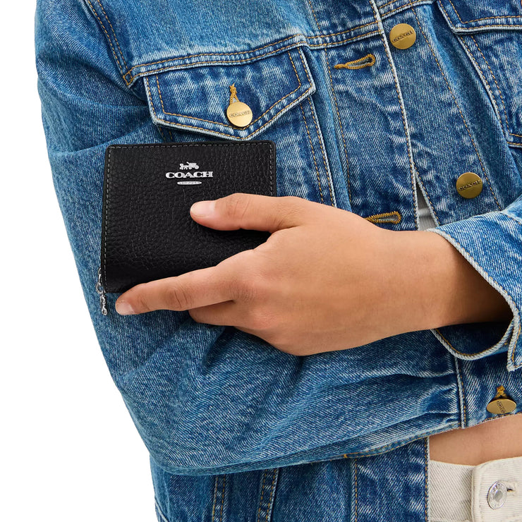 Model Holding Coach Snap Wallet - Black CBO77