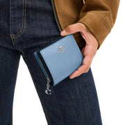 Model Holding Coach Snap Wallet - Pool CBO77