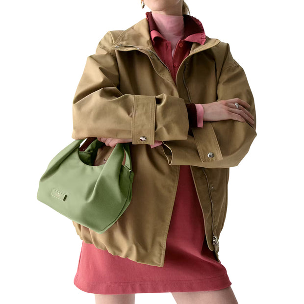 Model Carrying Kate Spade  Carter Nylon Small Pleated Crossbody Bag - Cedar Stand KL965