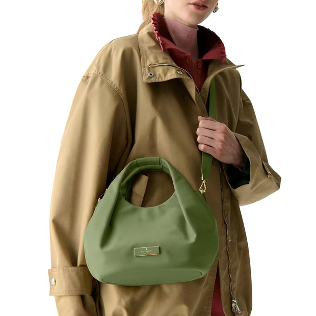 Model Wearing Kate Spade  Carter Nylon Small Pleated Crossbody Bag - Cedar Stand KL965