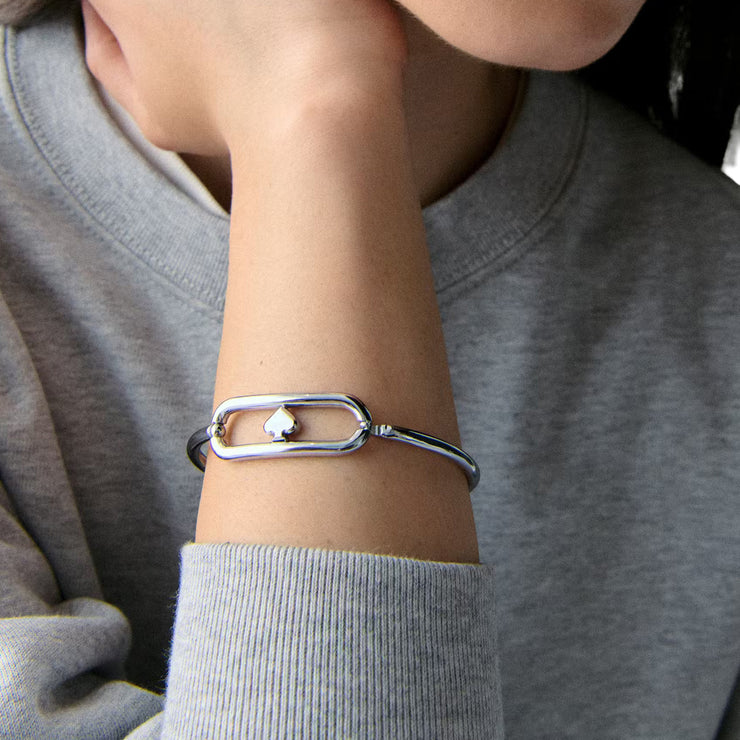 Model Wearing Kate Spade Cut To The Chase Oval Spade Bangle Bracelet - Silver KM177