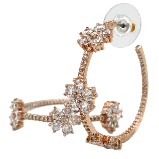 Front View of Kate Spade Gleaming Gardenia Flower Hoops Earrings in Clear/ Rose Gold o0ru3138