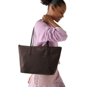 Model Carrying Kate Spade Kitt Nylon Medium Tote Bag - Hot Fudge KC455