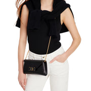Model Wearing Kate Spade Morgan Bow Embellished Envelope Flap Crossbody Bag - Black KF927
