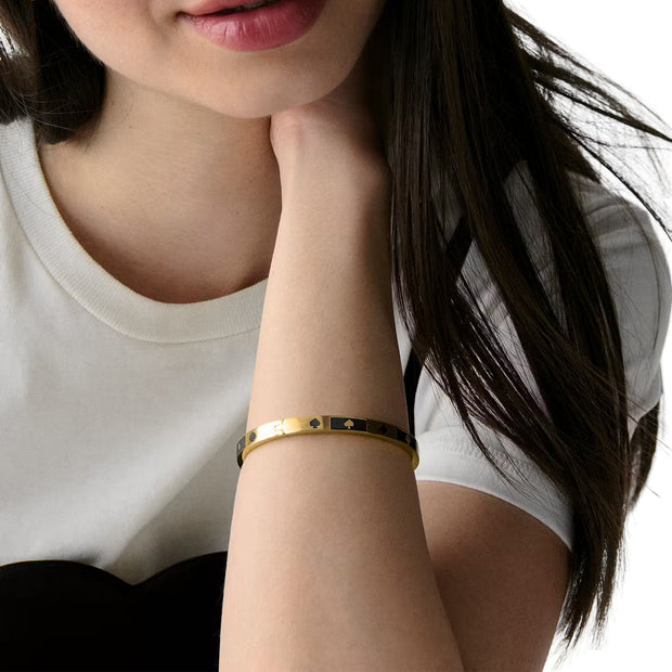 Model Wearing Kate Spade Spot The Spade Enamel Block Hinge Bangle Bracelet - Black KM186