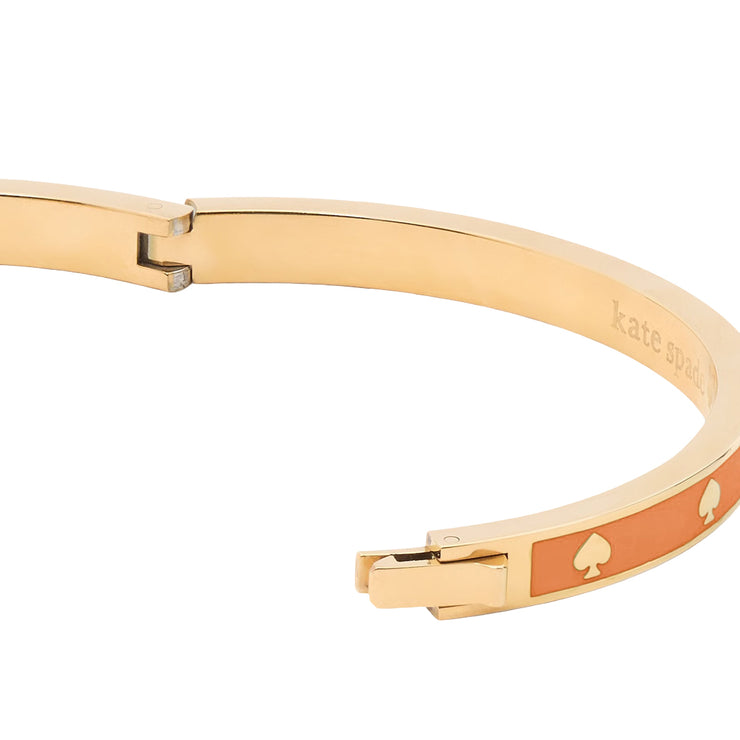 Closeup of Kate Spade Spot the Spade Enamel Hinged Bangle Bracelet - Cayenne Pepper KJ727