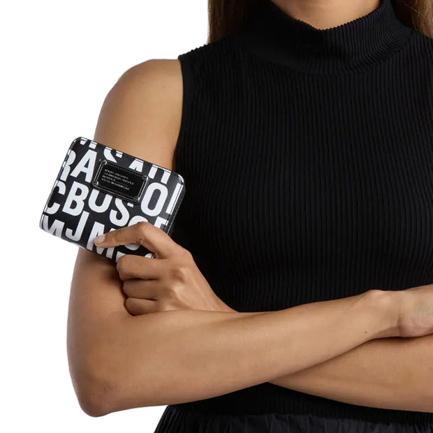 Model Holding Marc Jacobs Jumbled Logo Trademarc Mini Compact Wallet - Black/ White 4S4SMP009S02